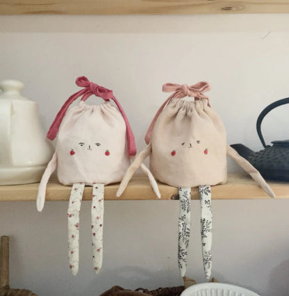Emmène pouch lichtroze met donkerroze lint ( middelste op de foto )